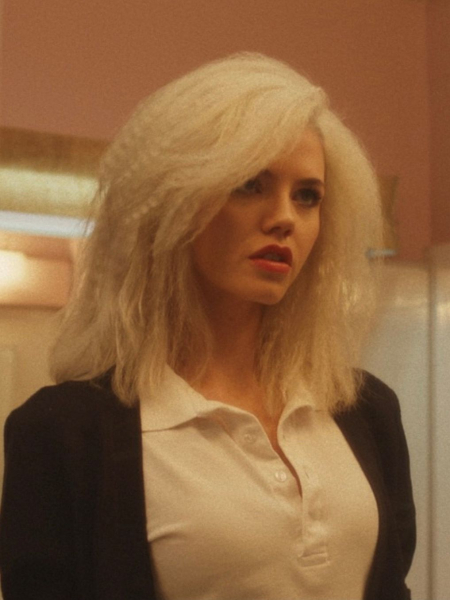 Actress Hayes Warner as Debbie in The Shards with her icy blonde hair crimped.